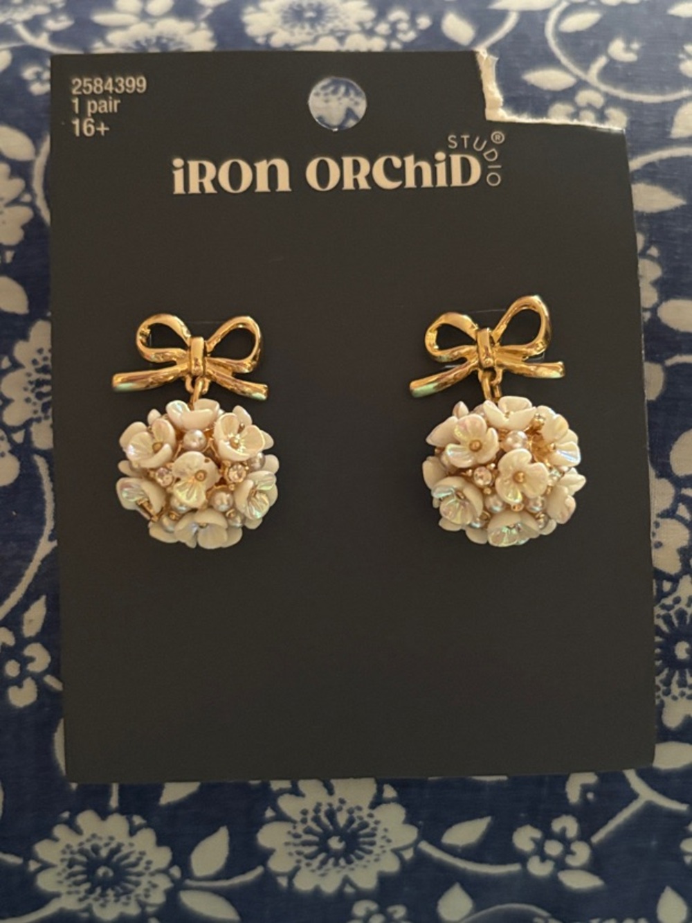 Iron Orchid Gold Bow Earrings with Cream Floral Clusters